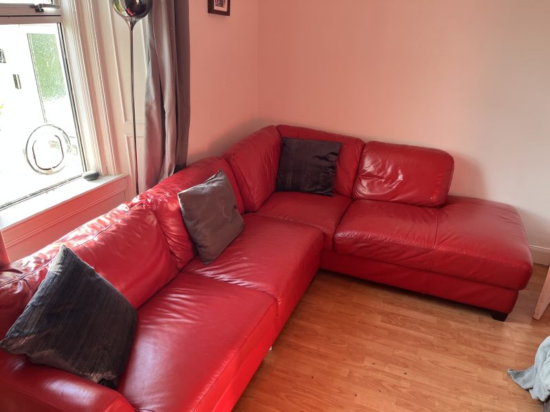 Large red leather corner sofa